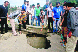 A damaged portion of the Qamarwari bridge in Srinagar on Tuesday. Photo: Yawar Kabli 