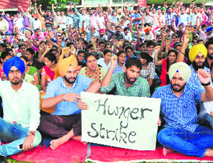 Students of the College of Agricultural Engineering on hunger strike at the PAU in Ludhiana on Tuesday. 