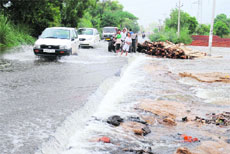 Water flows onto a road in Muktsar. 