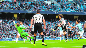 Manchester Citys David Silva (extreme right) heads to score against Newcastle United during their English Premier League match in Manchester on Monday.