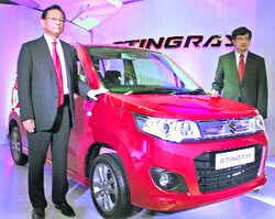 Maruti Suzuki India CEO Kenichi Ayukawa (L) and COO (Marketing and Sales) Mayank Pareek pose with Stingray at its launch in New Delhi on Wednesday. 