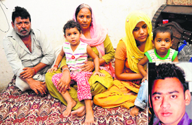 Family members of 26-year-old Avinash (inset) who was killed in a road accident involving stray cattle.