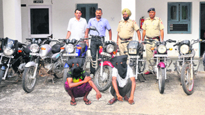 Two members of a vehicle-lifters gang in police custody at Sector 26, Chandigarh, on Wednesday.