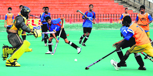 Players struggle for the ball during the 12th ONGC SN Vohra Memorial Sub-Junior Tournament at Hockey Stadium, Sector 42, in Chandigarh on Wednesday