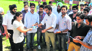 NSUI supporters canvass at a department in Punjab University in Chandigarh on Wednesday.