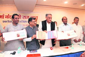 Uttarakhand Chief Minister Vijay Bahuguna releases a postage stamp on the Nanda Devi Rajjat Yatra in Dehradun on Wednesday