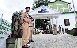 Police personnel stand guard at the Vidhan Sabha in Shimla on Wednesday