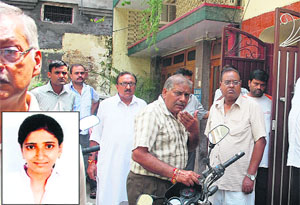 Family members and relatives of Sonali Aggarwal (inset), who committed suicide in Mandi Fentom Ganj, gather at her house in Jalandhar on Wednesday. 