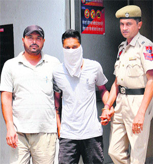 Accused in Vicky murder case in police custody in Jalandhar on Wednesday. 