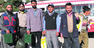 Polling staff with ballot boxes and other election material in Kargil on Wednesday. 