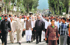 Leaders along with people from both communities participate in a peace march in Kishtwar on Wednesday. 