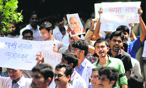 Protesters raise slogans at a rally in Pune on Wednesday. 
