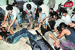 Syrian citizens receive treatment after an alleged poisonous gas attack by regime forces in a Damascus town on Wednesday