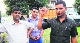 The victims brother, Milap Chand  with his relatives outside the Sector 31 police station in Chandigarh.