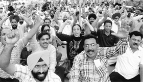 Members of the Punjab and Chandigarh College Teachers’ Union protest outside the office of Director Public Instructions at Phase VIII in Mohali on Thursday.