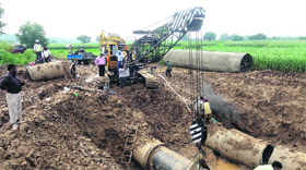Workers repair the damaged pipeline at Gharuan in Mohali.