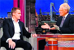 Hugh Evans in conversation with renowned chat show host David Letterman in the United States of America.