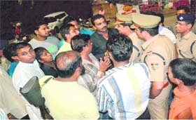 Vishwa Hindu Parishad activists oppose Uttar Pradesh minister Azam Khan on the 84 kosi parikrama issue outside Shri Kali Mandir at Chandighat on Wednesday night in Haridwar
