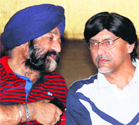 In charge of the Parliamentary polls for the SAD Jalandhar (Urban) Harish Rai Dhanda interacts with district SAD president Gurcharan Singh Channi during a meeting in Jalandhar on Thursday. 