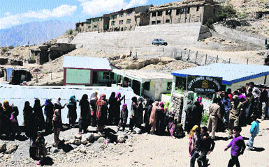 Voters line up in Kargil on Thursday.