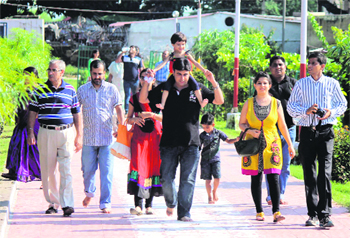 Devotees on the way to pay obeisance at Kali Temple at Bawe in Jammu. Tribune Photo: Inderjeet Singh