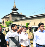 Minister for Tourism Ghulam Ahmad Mir inspects construction works at the Jamia Masjid. A Tribune photograph