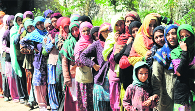 Women wait to cast their vote at Tumail, 25 km from Kargil, on Thursday. Tribune photo: Amin War