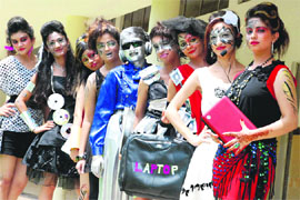 Students show the evolution of technology dressed as and holding gadgets during a fest at MCM DAV College in Sector 36, Chandigarh, on Friday.