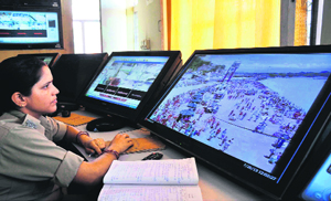 A policewoman monitors the Har-ki-Pauri area through CCTVs in Haridwar. A file photograph