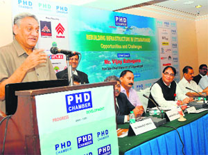 Chief Minister Vijay Bahuguna speaks at a seminar organised by the PHD Chamber of Commerce in Dehradun on Friday.