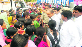 Girls from Government PG College block vehicular traffic at Bhodia Khera in Fatehabad on Friday.