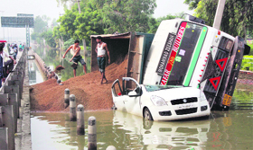 The truck carrying building material that fell on a Marut Ritz car in the Hero Honda chowk service lane in Gurgaon on Friday.