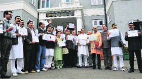 BJP legislators raise slogans outside the Vidhan Sabha in Shimla on Friday.