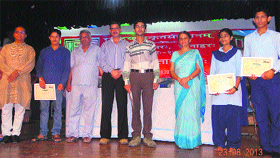 Students receive prizes on the concluding day of the week-long Sanskrit festival at Pragpur on Friday.