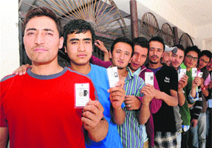 Voters line up to cast their ballot in Kargil on Thursday.
