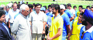  Governor N N Vohra interacts with a participating team during the inaugural function of Senior National Rugby 7s Championship in Srinagar. 