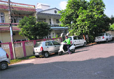 The broken electricity cable lies on the road at Shastri Nagar in Jammu on Friday. 