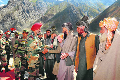  Senior Army officers shake hands with Bakarwals at the inauguration of Bakarwal Mela  2013 at Manimarg, Drass. Army organised a free medical camp and Gujjar cultural programmes at the mela before the Bakarwals move towards Jammu from mountains, on Friday.