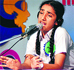 A student takes part in a radio jockey competition held at Bal Bharti School in Ludhiana