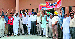 Members of the Minibus Owners Association hold a protest outside the Mini-Secretariat against the hike in annual tax