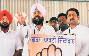 Pradesh Congress Committee chief Partap Singh Bajwa addresses a rally in Sangrur on Friday. On his left is Sangrur MP Vijay Inder Singla and on the right former MLA Surinder Pal Singh Sibia.