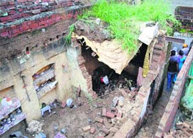 The collapsed roof of a house in the Islamabad area in Amritsar