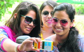 Students watch a video released by the NSUI at PU in Chandigarh on Saturday. 