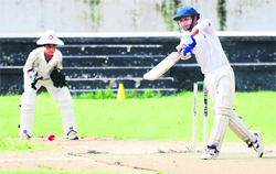 A batsman knocks the ball as the wicketkeeper looks on during a cricket match at St Josephs Senior Secondary School in Sector 44, Chandigarh, on Saturday. 