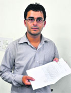 Lokinder Kumar shows the copy of DDR that was registered by the Sector 34 police in Chandigarh. 