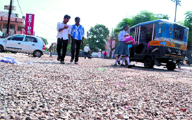 A road that has not been recarpeted fully by the Public Works Department poses problems for commuters on Saturday in Haridwar.