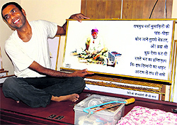Sanjeeb Kumar Katiyar with one of his illustrated poems