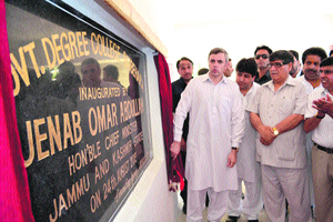 Chief Minister Omar Abdullah inaugurates the Degree College building at Bijbehara in Anantnag district on Saturday. With him is Higher Education Minister Akbar Lone.