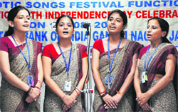 Women participate in a patriotic group song event to celebrate Independence Day in Jammu on Saturday.
