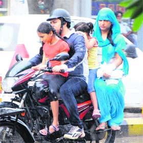 Savouring showers: A family enjoys early morning showers on a rainy day in Amritsar